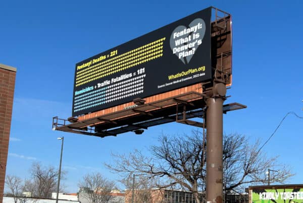 A billboard showing fentanyl deaths outpacing traffic fatalities and homicides in Denver.