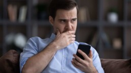 Man hesitation with phone