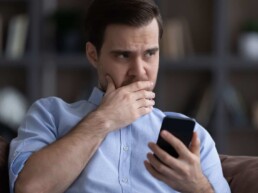 Man hesitation with phone
