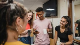 Group of youth in a classroom hanging out